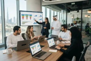 Sales professionals in a UAE office using CRM software to manage customer relationships and sales opportunities.